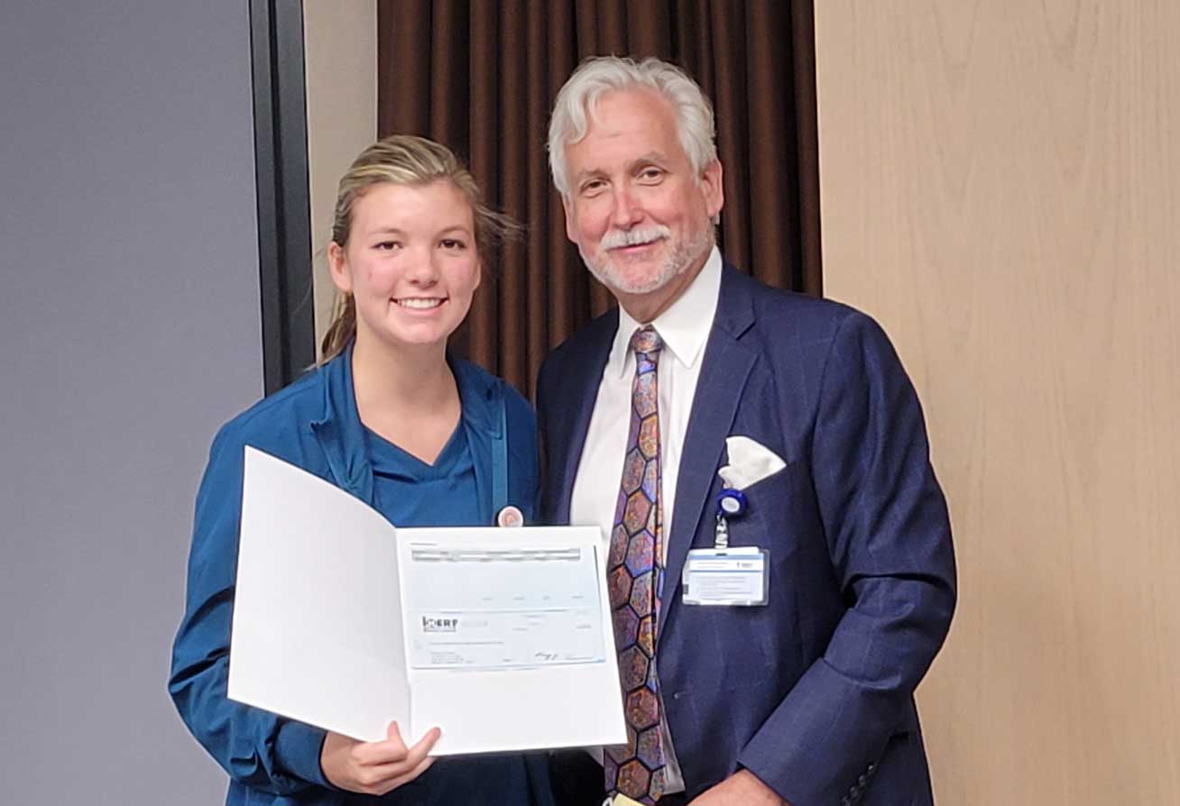 Paige Zaruba of Mercy Medical Center with Tim Charles, Receiving Scholarship